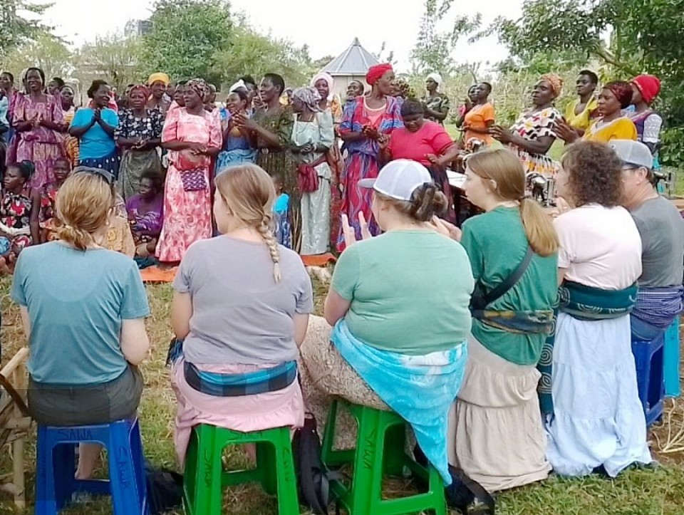 Visitors interacting with women
